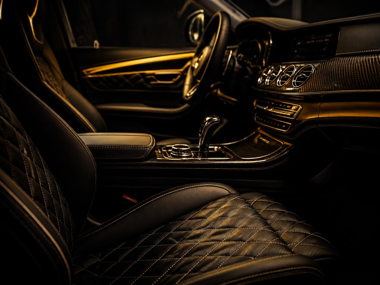 Detailer cleaning a car door panel